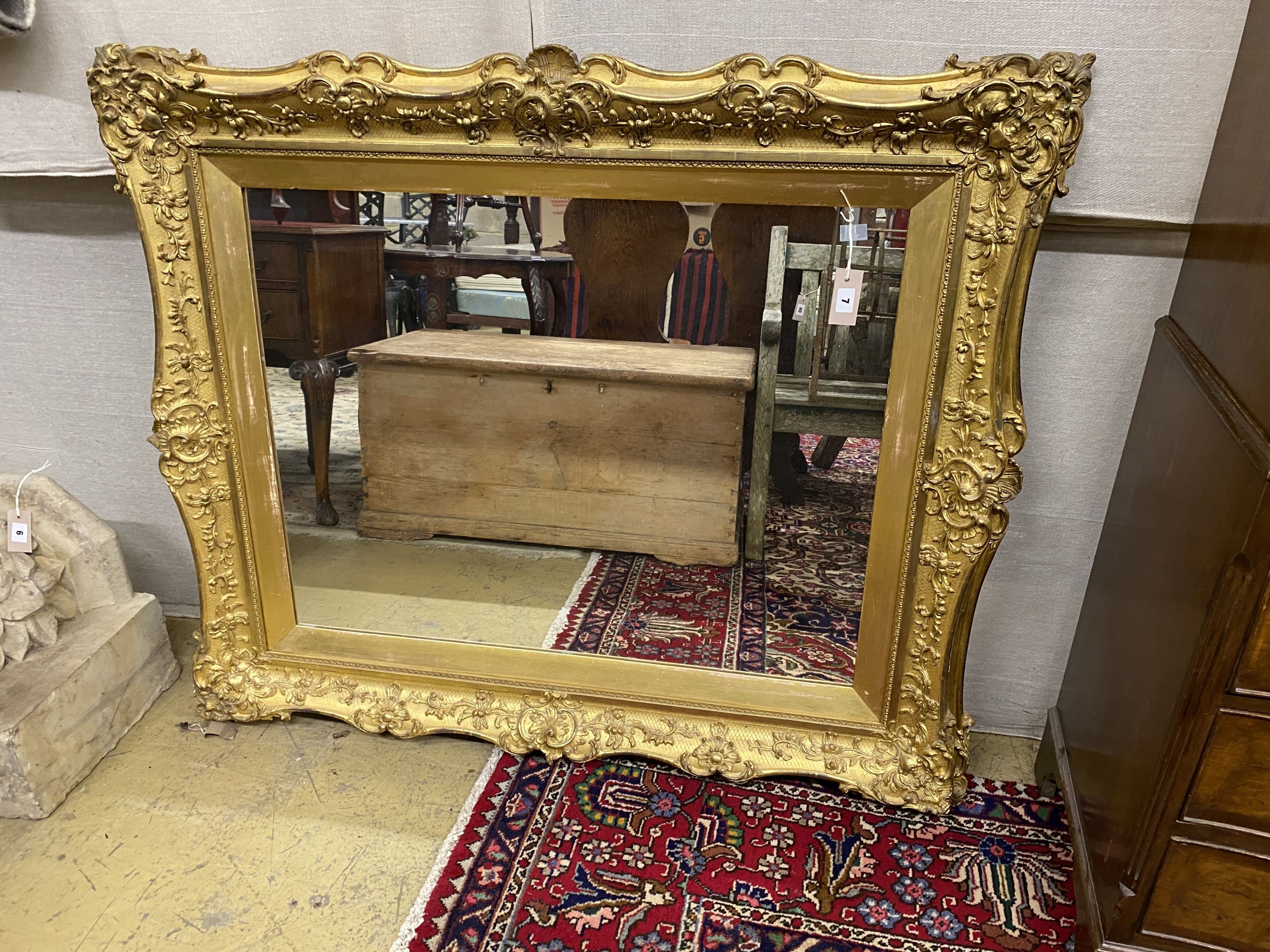 A Victorian giltwood and gesso rectangular wall mirror, width 124cm, height 106cm